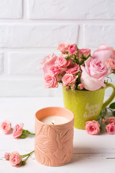 Burning Candle Pink Roses Flowers Cup White Brick Wall — Stock Photo, Image