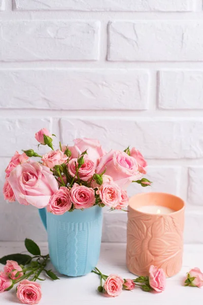 Burning Candle Pink Roses Flowers Cup White Brick Wall — Stock Photo, Image