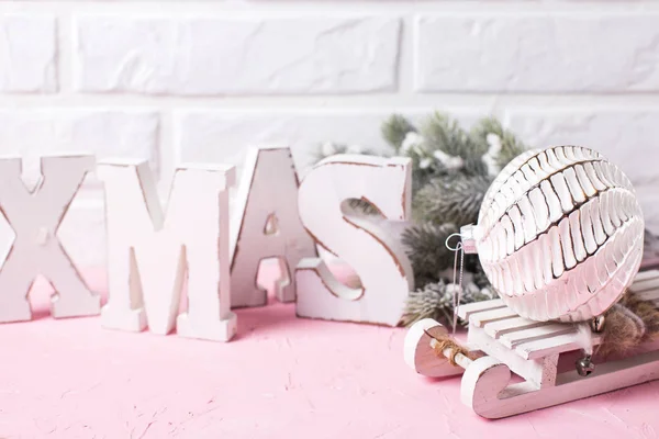 Christmas festive background with wooden word Xmas