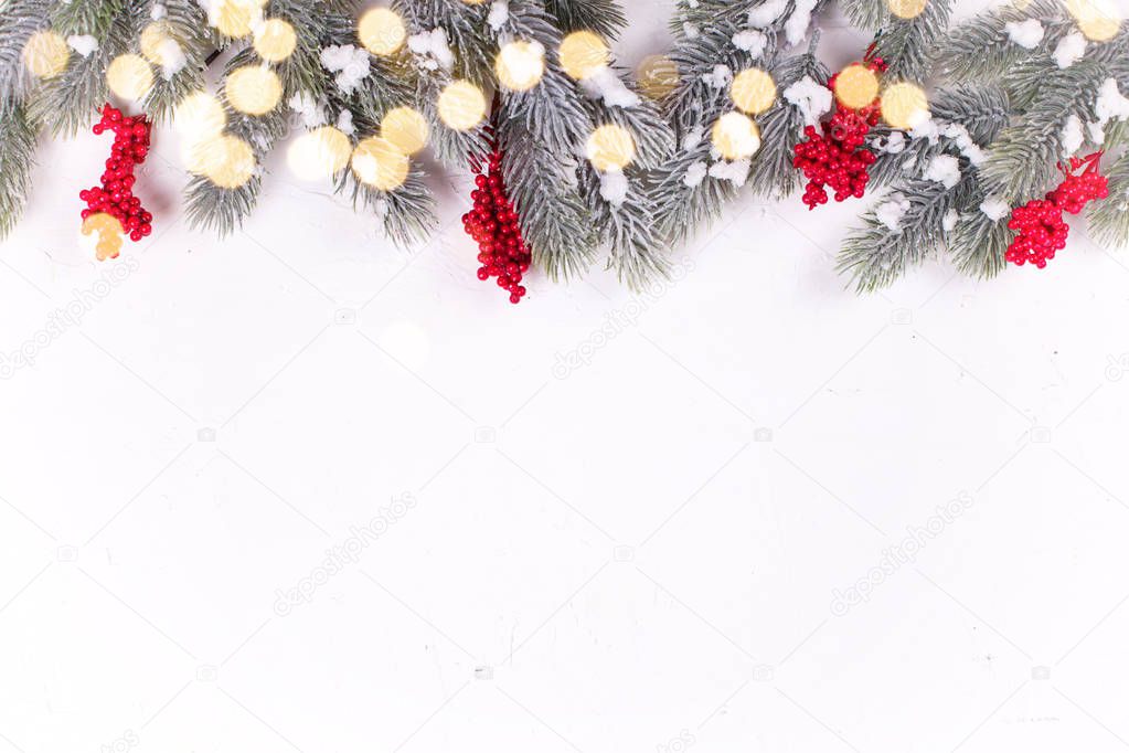 festive winter holidays composition with fir tree branches and christmas decorations
