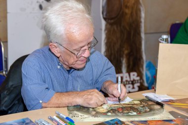 FUERTH, Germany - September 22nd 2018: Mike Edmonds (*1944, Actor -  Flash Gordon, The Dark Crystal, Who Framed Roger Rabbit, Time Bandits, Ewok Logray in Star Wars: Return of the Jedi & Operator for Jabba the Hutt's tail) at Noris Force Con 5 clipart