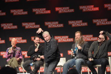 MANNHEIM, GERMANY - MAR 17th 2018: Ron Perlman, Ryan Hurst and Tommy Flanagan at Walker Stalker Germany, a two day convention for fans of The Walking Dead clipart