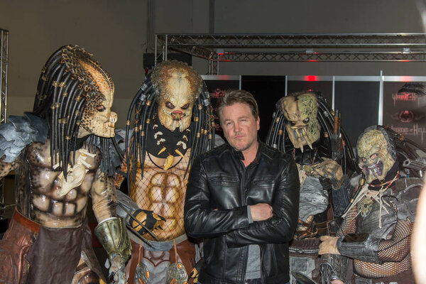 DORTMUND, GERMANY - APRIL 8: Actor Lochlyn Munro (Freddy vs. Jason, Scary Movie, Charmed, Riverdale) surrounded by predators at Weekend of Hell, a two day (April 7-8 2018) horror-themed fan convention.