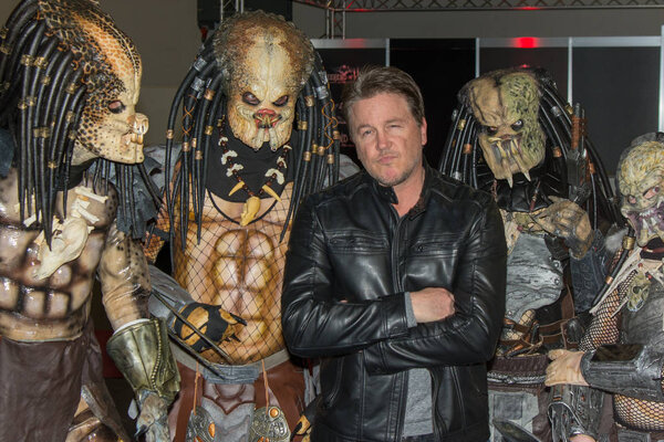 DORTMUND, GERMANY - APRIL 8: Actor Lochlyn Munro (Freddy vs. Jason, Scary Movie, Charmed, Riverdale) surrounded by predators at Weekend of Hell, a two day (April 7-8 2018) horror-themed fan convention.