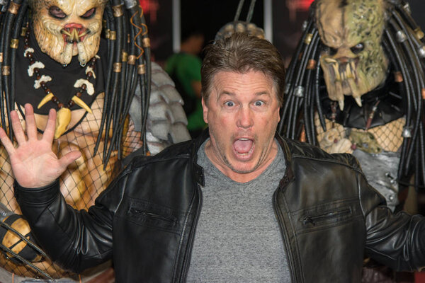 DORTMUND, GERMANY - APRIL 8: Actor Lochlyn Munro (Freddy vs. Jason, Scary Movie, Charmed, Riverdale) surrounded by predators at Weekend of Hell, a two day (April 7-8 2018) horror-themed fan convention.