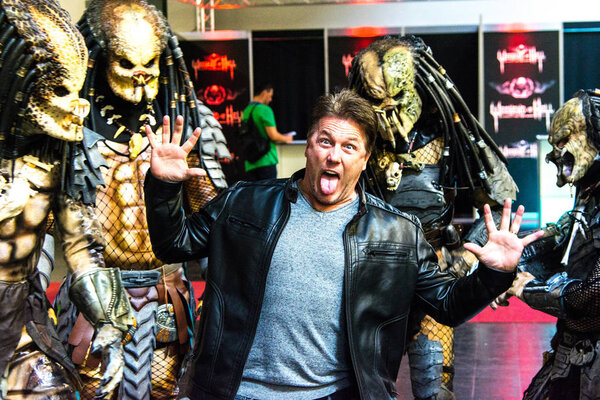 DORTMUND, GERMANY - APRIL 8: Actor Lochlyn Munro (Freddy vs. Jason, Scary Movie, Charmed, Riverdale) surrounded by predators at Weekend of Hell, a two day (April 7-8 2018) horror-themed fan convention.