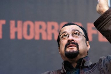 DORTMUND, GERMANY - November 3rd 2018: Steven Seagal (*1952, American actor, martial artist, and film producer - Red Alert, Nico, Deadly Revenge) at Weekend of Hell 2018 clipart