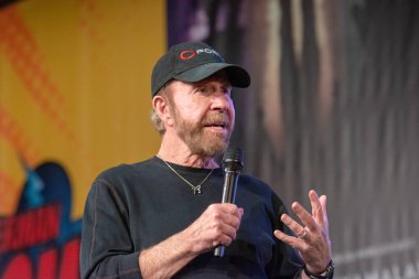 DORTMUND, GERMANY - December 1st 2018: Chuck Norris (*1940, American martial artist, actor, film producer and screenwriter) at German Comic Con Dortmund, a two day fan convention clipart