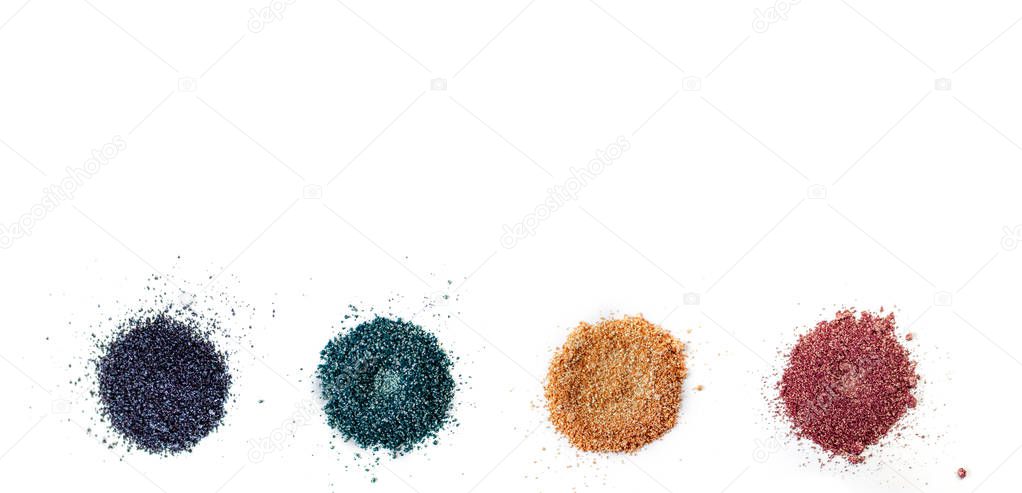A set of color pigments in different shades, pigment powder close up, glitter eyeshadow or mica. Isolated on a white background, top view