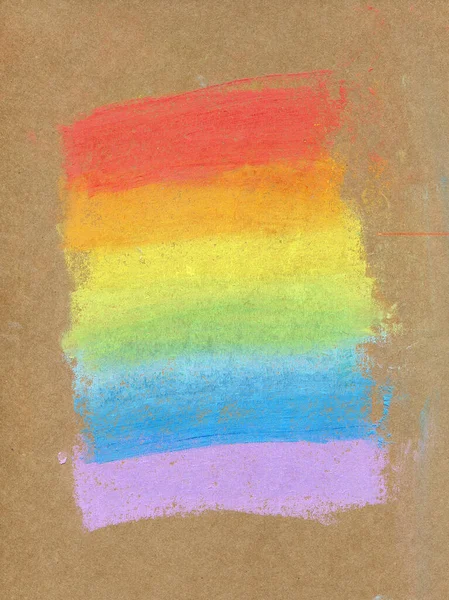 Renkli gökkuşağı tebeşirli pastel arka plan veya yumuşak pastel. Gökkuşağı gradyanı, kaba desenli bir el işi kağıdına çizilmiş.
