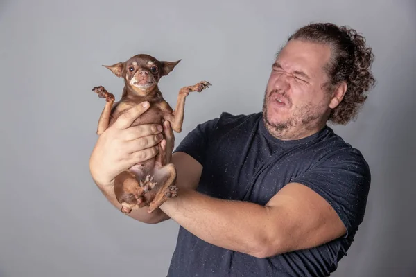 Funny fat man with little dog