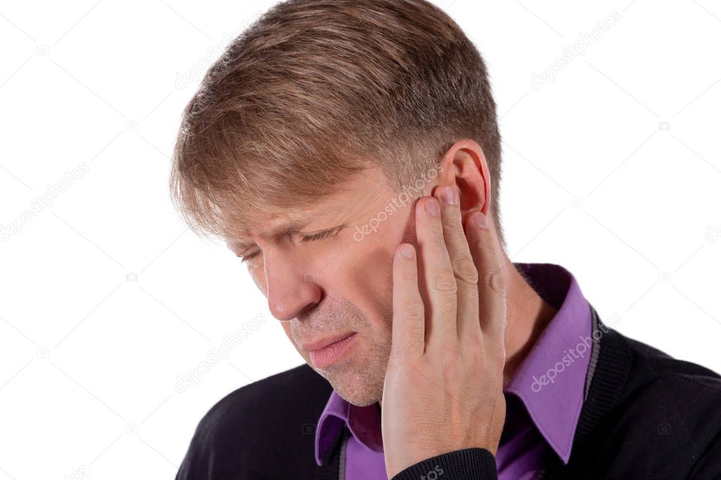 Man has a sore ear. Man suffering from earache