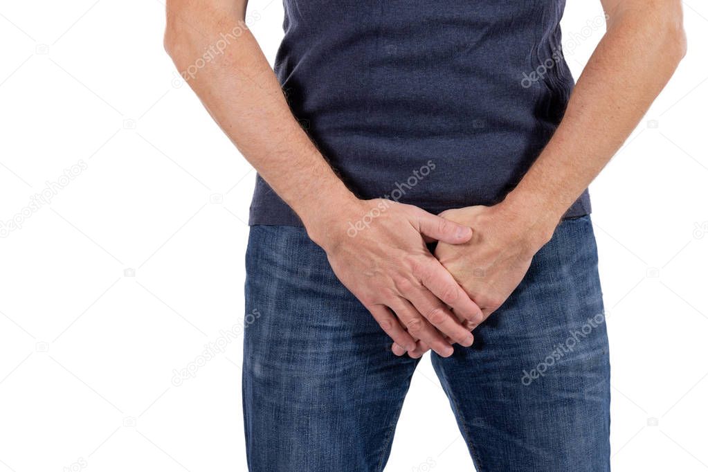Man holding his urethra in pain. Man experience urethra pain on white background