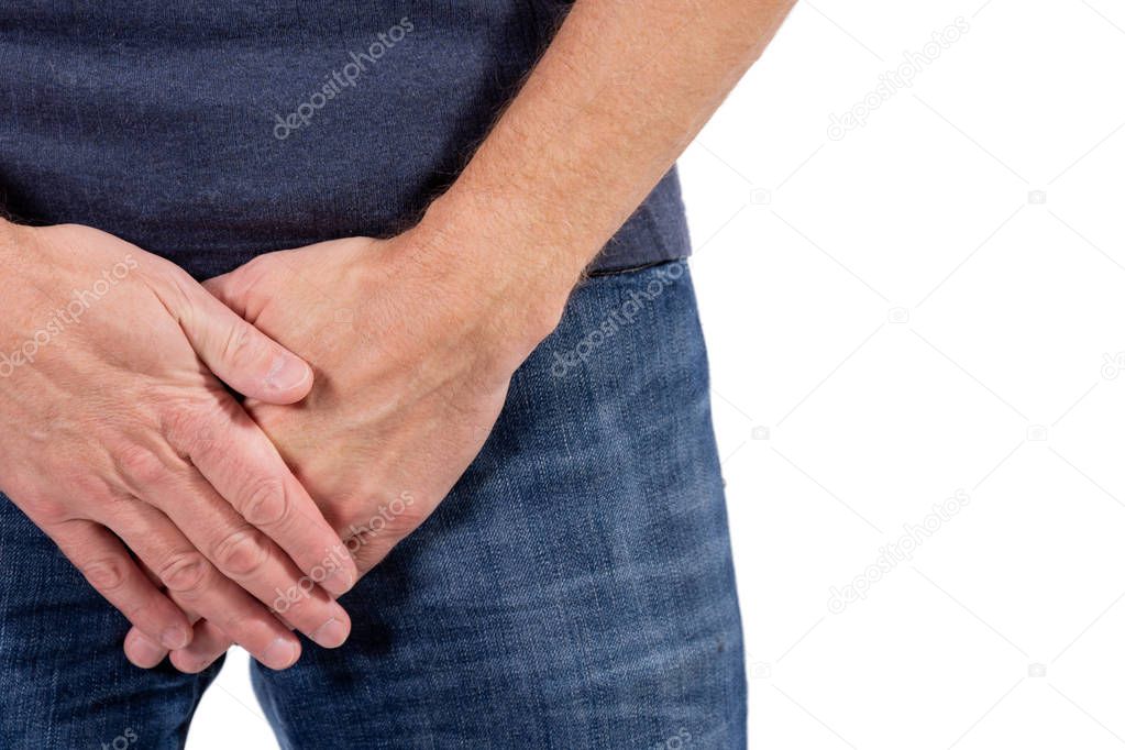 Man holding his urethra in pain. Man experience urethra pain on white background