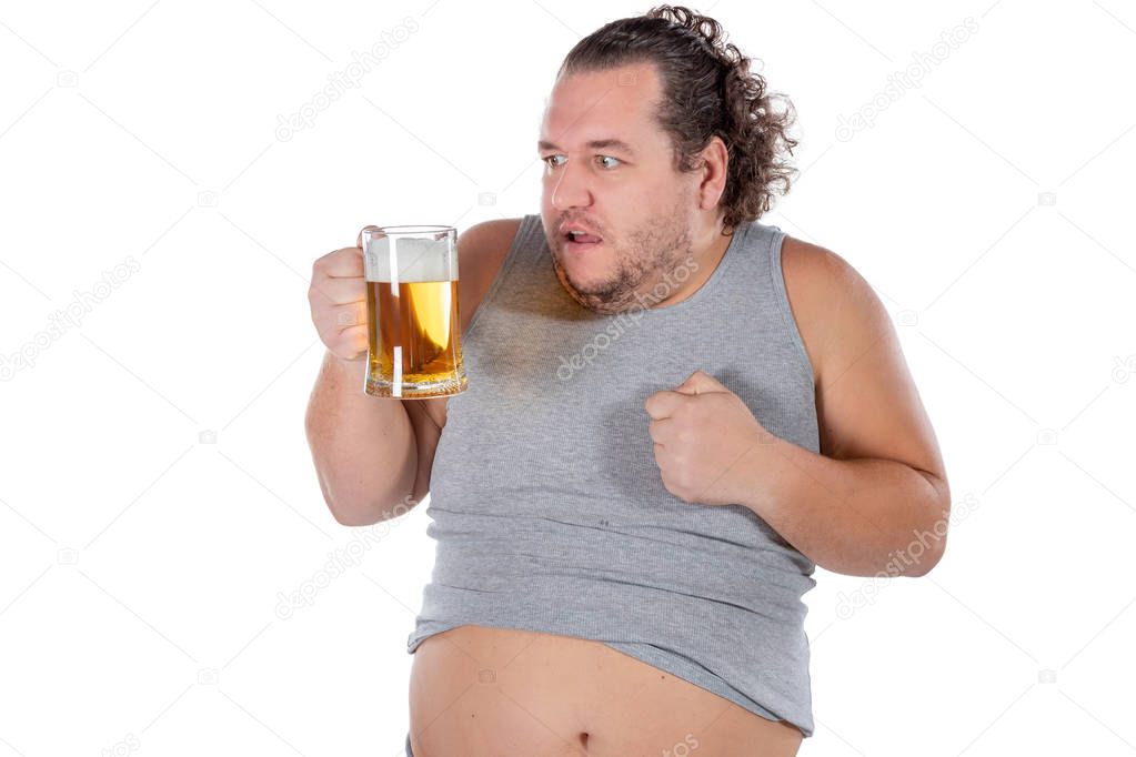 Funny fat man feeling happy and relaxed, holding fresh cold beer in his hands