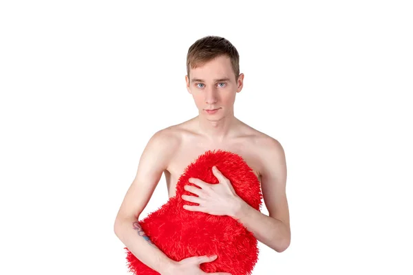Handsome guy hold big red heart on white background. Love and romantic concept.