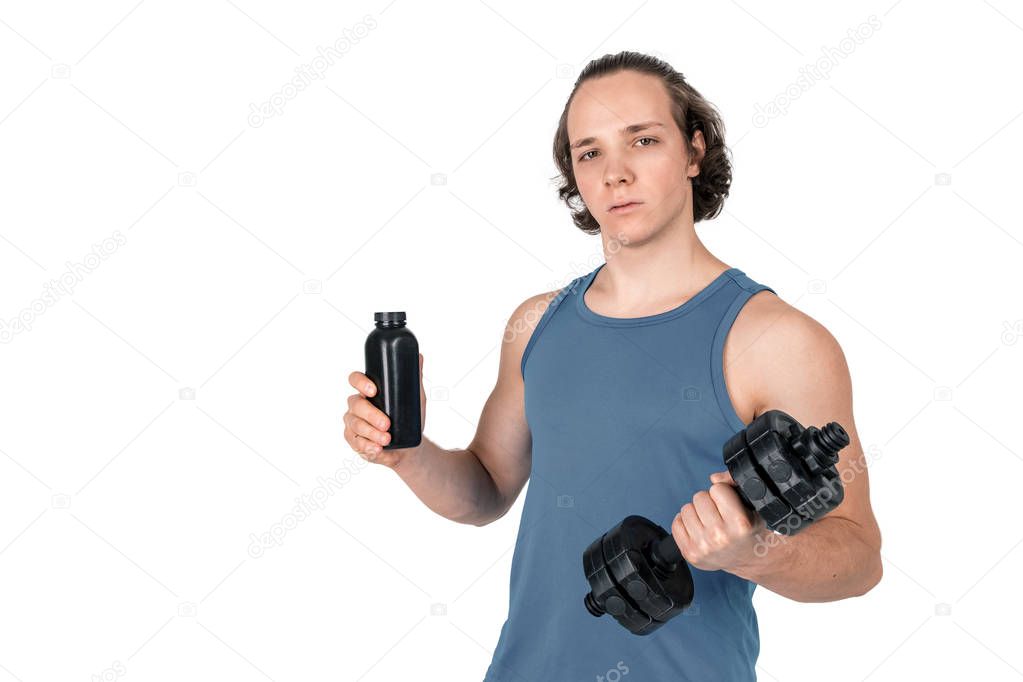 Handsome young man in blue shirt lifting dumbbell. White background isolated