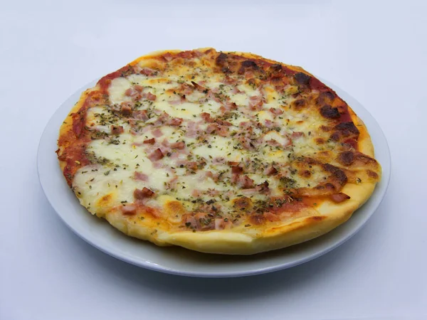 Pizza with ham and mozzarella (pizza al prosciutto) traditional italian food