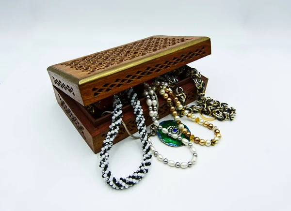 Wooden jewelry box, treasure box, on white background, studio shot