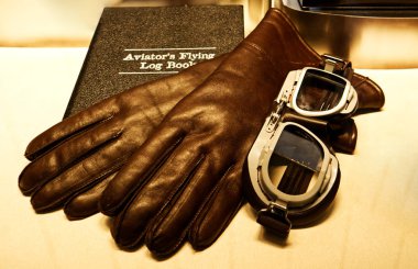 Aviator's flying log book. Log book, pilot gloves and glasses clipart