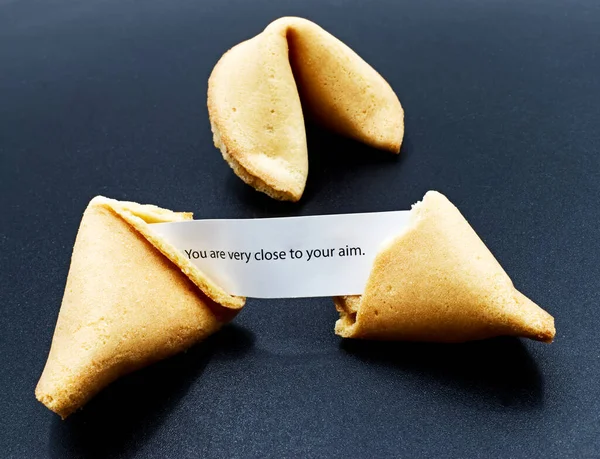 Chinese fortune cookie isolated on dark background