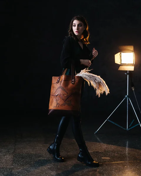 Leather bag with a model