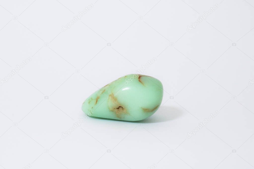 Chrysoprase, close-up of a precious stone with a white background, collectibles