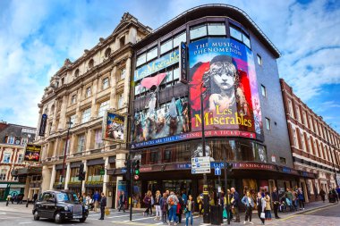 LONDON, UNITED KINGDOM - MAY 13 2018: Queen's Theatre  in Shaftesbury Ave. on the corner of Wardour St. opened on 8 October 1907 as a twin to the neighbouring Hicks Theatre (now Gielgud Theatre) clipart