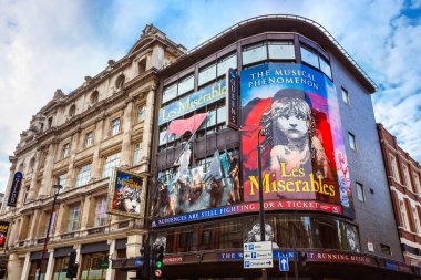 LONDON, UNITED KINGDOM - MAY 13 2018: Queen's Theatre  in Shaftesbury Ave. on the corner of Wardour St. opened on 8 October 1907 as a twin to the neighbouring Hicks Theatre (now Gielgud Theatre) clipart