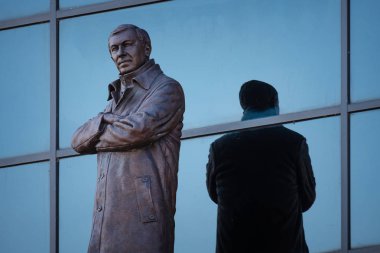 MANCHESTER, UK - MAY 19 2018: Sir Alex Ferguson Bronze statue in front of Alex Ferguson stand at Old Trafford stadium, the Home of Manchester United