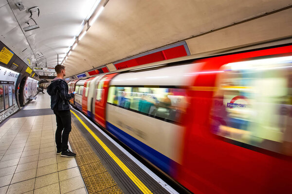London, UK - May 13 2018: Unidentified people travel through underground train network in London
