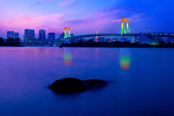 Colorful illuminations at Rainbow Bridge from Odaiba in Tokyo, Japan