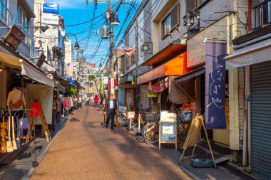 Tokyo, Japan - April 25 2018: Yanaka Ginza is one of the few districts in Tokyo where the shitamachi atmosphere, an old town ambience reminiscent of Tokyo from past decades, still survives clipart