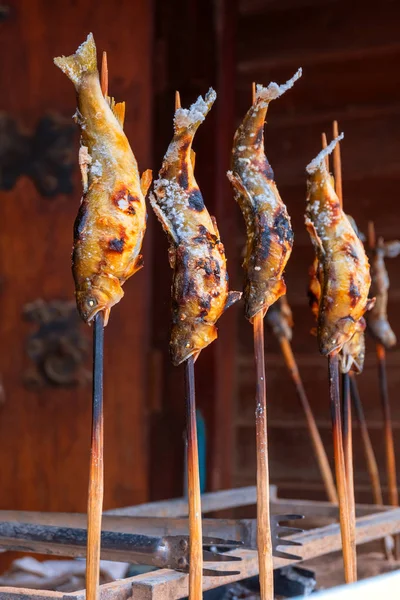 Traditional Japanese grilled fish on the way to  Sainokawara Park in Kusatsu onsen hot spring town