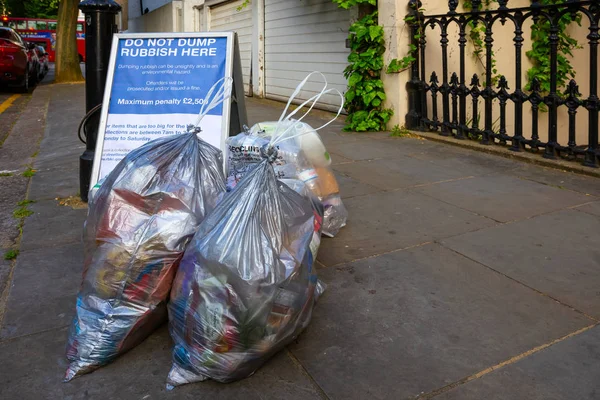 Group of plastic bags contain garbage for dumping on the pavement — Stock Photo, Image