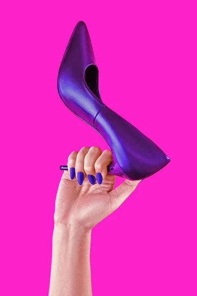 Womans power poster on pink background. Woman hand holding high heels shoe. Creative poster for sale or buisiness. Copy space for design