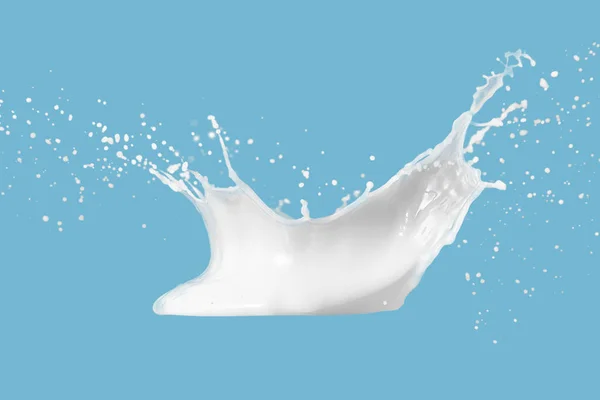 牛奶或白色液体飞溅的照片 滴落在蓝色背景上 — 图库照片