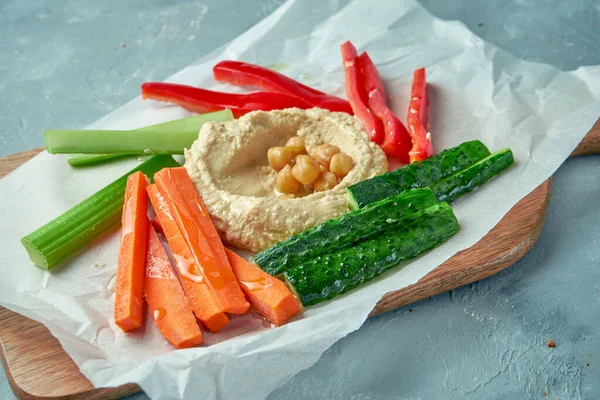 Classic hummus with vegetable sticks (pepper, cucumber, carrot and celery)