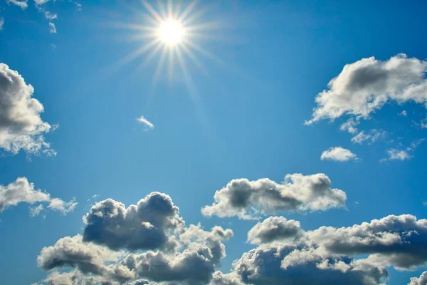 Blue sky with clouds and sun background — Stock Photo, Image