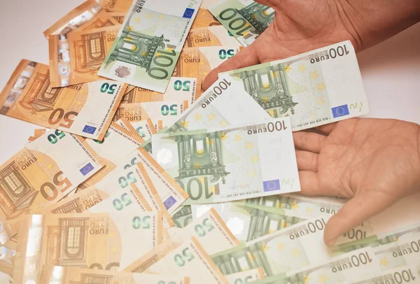 Euro banknotes in female hand. Euro cash background of money.Selective focus