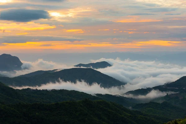 Sunset mountain sky view on the morning with sea of fog in Thailand.  Mountain sunrise sky clouds.