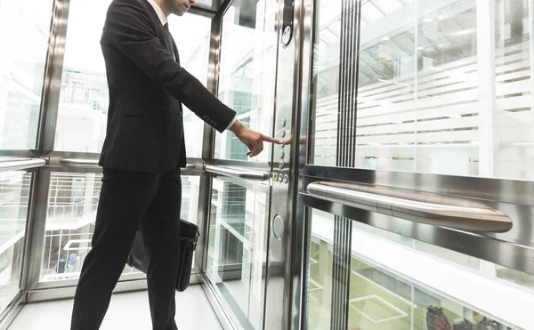 Man pressing elevator button. finger presses elevator button. businessman in lift — Stock Photo, Image