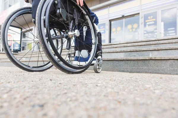 Man in wheelchair in front of stairs. — Stock Photo, Image