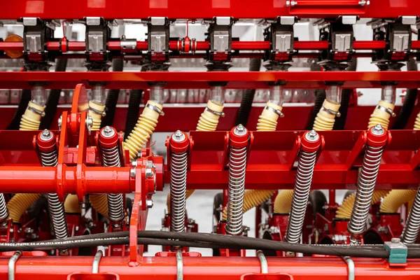 Agricultural machinery. Close-up of technical units and mechanisms of agricultural machinery. Springs and suspension elements