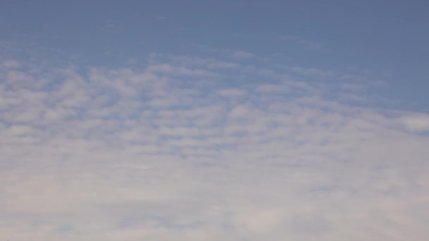 4K timelapse light feather clouds floating in the blue sky — Stock Video