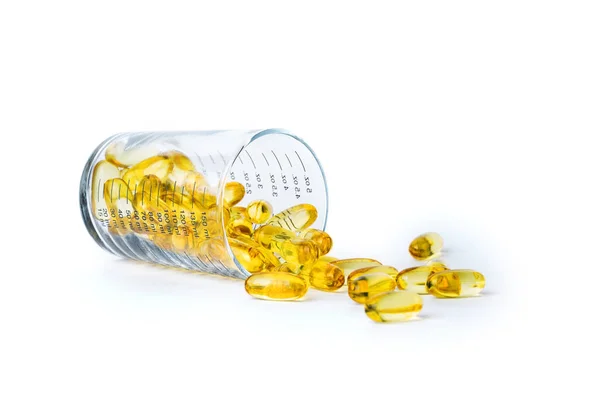 Leuchtend Gelbe Fischöl Kapseln Glasmaß Auf Weißem Hintergrund Aufgenommen Mit — Stockfoto