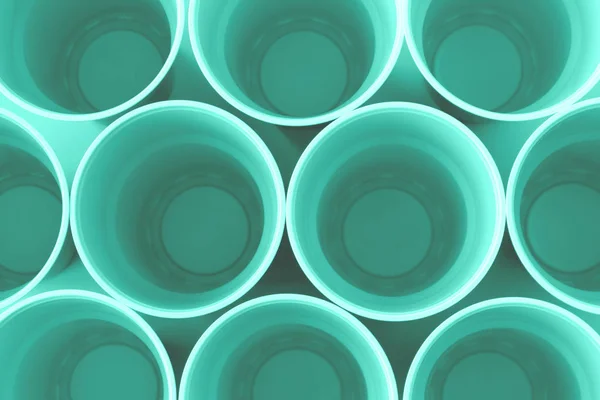 Top uitzicht van kunststof Neon mint cups. — Stockfoto