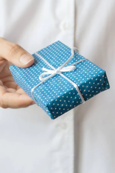 Gift box in womans hands. Christmas concept.