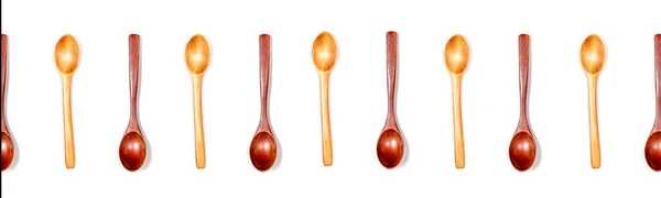 Wooden spoons isolated on white background banner. — Stock Photo, Image