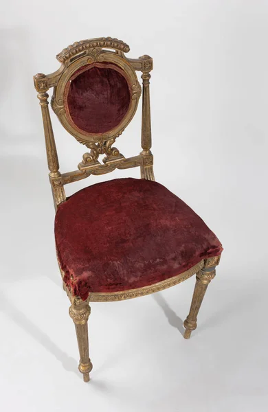 antique chair with velvet decoration, on white background.